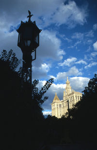 Low angle view of silhouette cathedral against sky