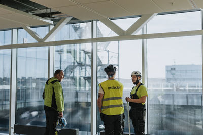 People talking at construction site