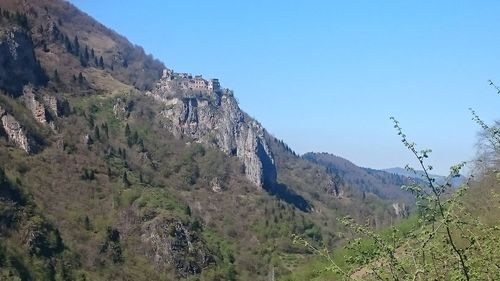 Panoramic view of mountains against clear sky