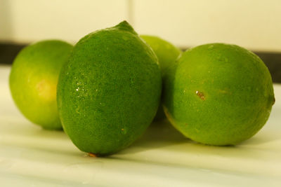 Close-up of green apples on table