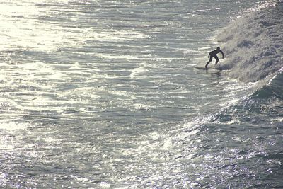 High angle view of man surfing on water