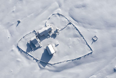 High angle view of snow on field against sky