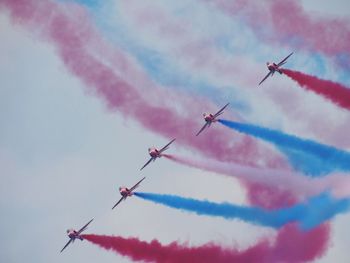 Low angle view of airplane flying in sky