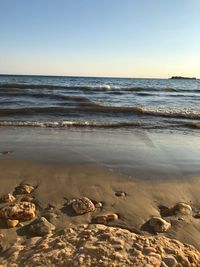 Scenic view of sea against clear sky