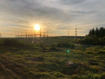 Scenic view of field against sky during sunset