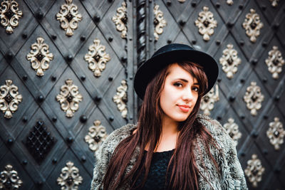 Portrait of smiling woman standing outdoors