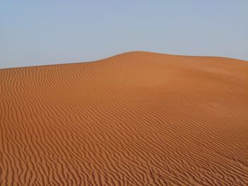 Scenic view of desert against clear sky