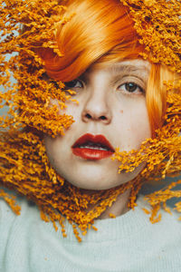 Close-up portrait of woman in autumn