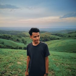 Portrait of man standing on land