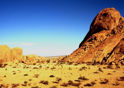 Rock formations against blue sky