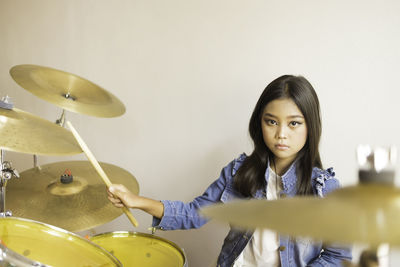 Portrait of woman playing musical instrument