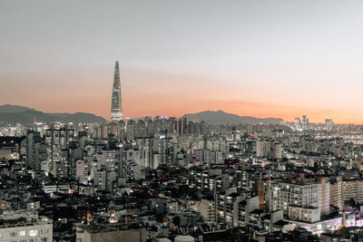 High angle view of city buildings during sunset