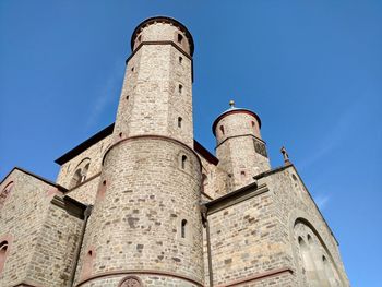 Low angle view of tower against blue sky