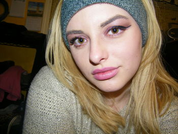 Close-up portrait of beautiful young woman at home