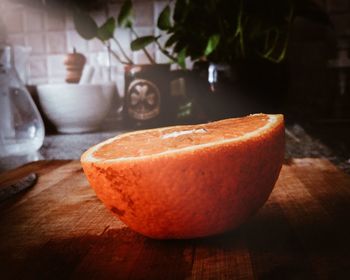 Close-up of orange slice on cutting board