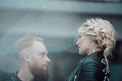 Portrait of couple kissing outdoors