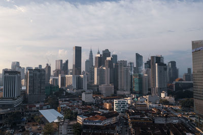 Aerial view of modern buildings in city against sky