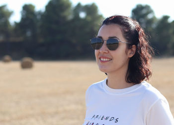 Portrait of young woman wearing sunglasses