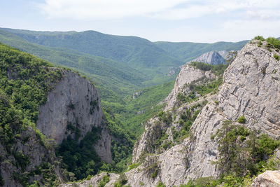 Scenic view of rocky mountains against sky