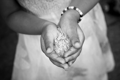 Close-up of woman holding rice