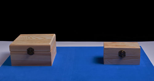 High angle view of stack on table against black background