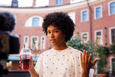 Young woman drinking glass