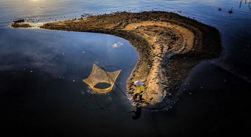 High angle view of man at puddle