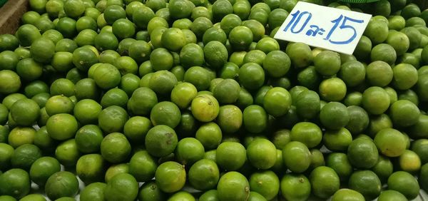 Close-up of green fruits for sale in market