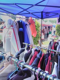 Clothes drying on market stall