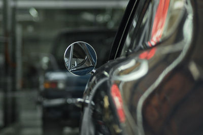 Close-up of vintage car on side-view mirror
