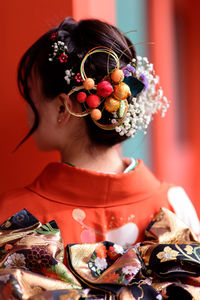 Portrait of woman with flower ornament