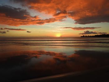 Scenic view of sea against romantic sky at sunset