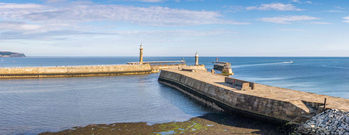 Scenic view of pier by against sky