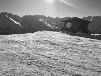 Scenic view of snow covered mountain against sky