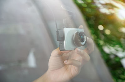 Close-up of hand holding camera