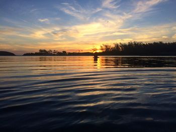 View of lake against cloudy sky during sunset