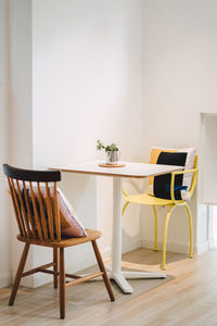 Table and chairs on hardwood floor at home