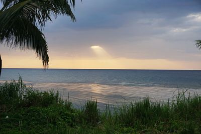 Scenic view of sea against sky at sunset