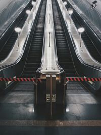 Symmetrical view of escalators in underground station