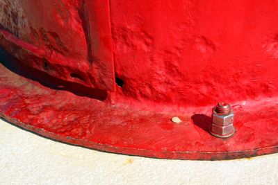 High angle view of red paint on wall