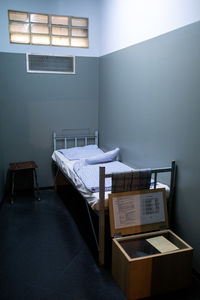 Empty chairs and table against wall at home