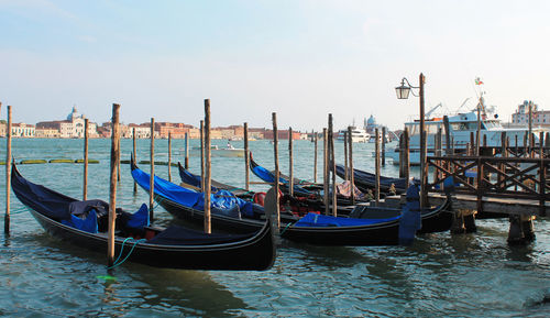 Boats moored in canal