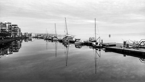 Boats moored at harbor