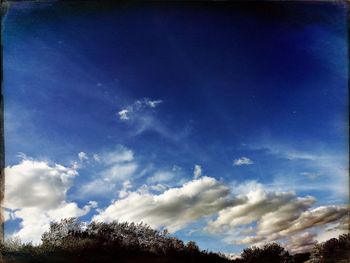 Low angle view of blue sky and clouds