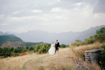 Rear view of man standing on mountain