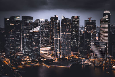 High angle view of illuminated buildings in city at night