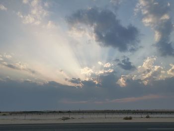 Scenic view of land against sky during sunset