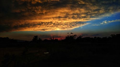 Scenic view of dramatic sky during sunset