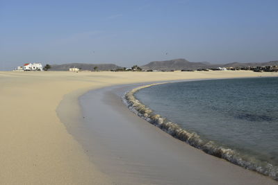 Scenic view of beach against sky