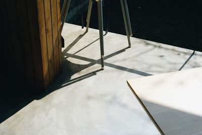 High angle view of empty chair on table